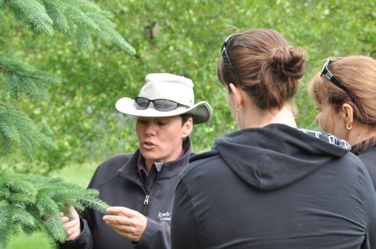 Anna-Marie discussing tree interpretation with tour group